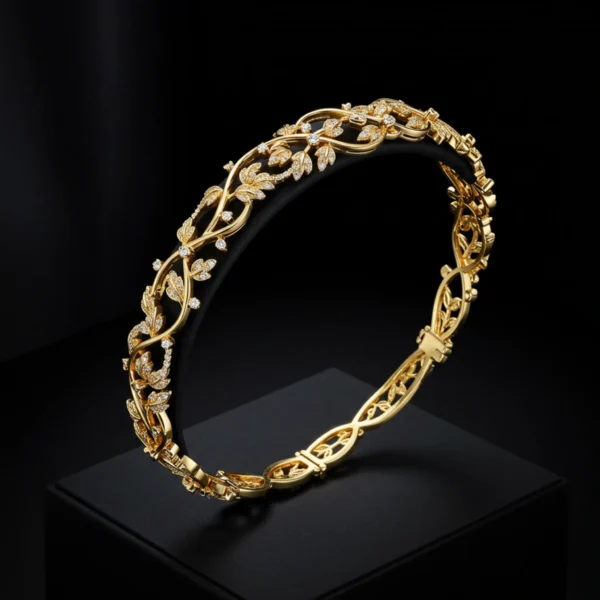 Studio display of the Elora Vine 18k gold bracelet featuring intricate diamond-studded leaf and vine patterns.