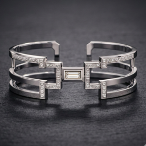 Architectural silver Icon Cuff featuring a central baguette diamond, triple-band open frame, and geometric pavé-set diamond accents.
