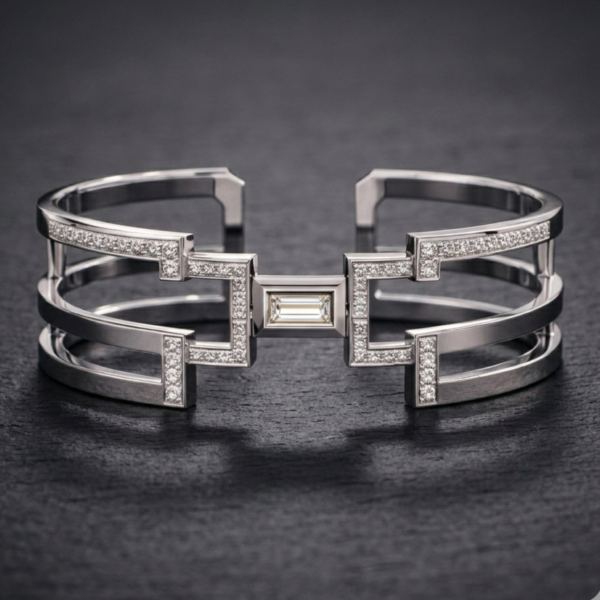 Architectural silver Icon Cuff featuring a central baguette diamond, triple-band open frame, and geometric pavé-set diamond accents.