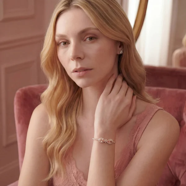 A romantic-style portrait of a woman wearing the Embress morganite and diamond bracelet from the Velvet line.