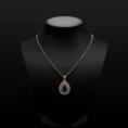 Azure Majesty sapphire pendant on a black jewelry bust