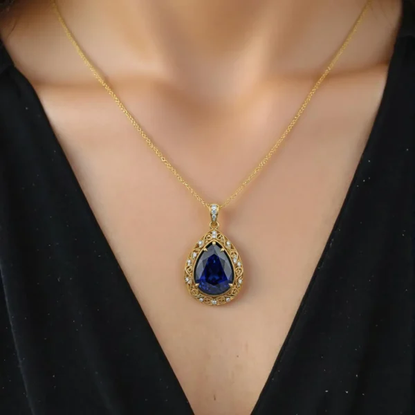 Close-up of sapphire pendant necklace on a woman's neck