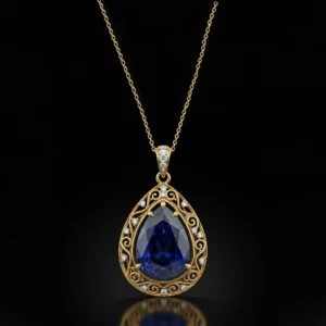 Close-up of teardrop sapphire pendant with gold filigree