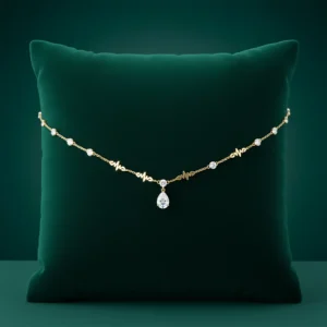 Cleopatra gold necklace on green velvet pillow