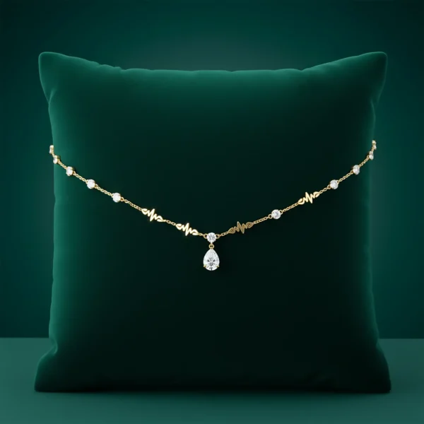 Cleopatra gold necklace on green velvet pillow