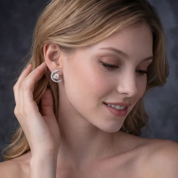 Pair of silver crescent moon diamond earrings