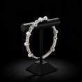 18k white gold pearl and diamond bracelet on black display stand