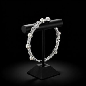 18k white gold pearl and diamond bracelet on black display stand