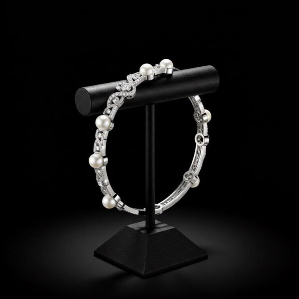 18k white gold pearl and diamond bracelet on black display stand