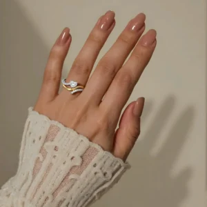 Close-up of Eternal Wave ring on a hand.