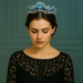 Woman wearing the Isla Tiara with eyes closed.