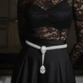 Diamond snake belt on black lace dress
