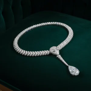 Luxury diamond serpent necklace on green velvet