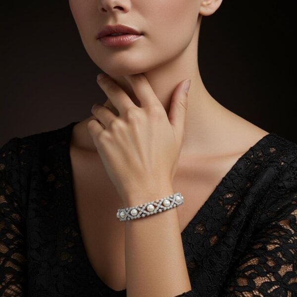 luxury-pearl-diamond-bracelet-model Woman in a black lace dress modeling the 18k white gold pearl and diamond bracelet.