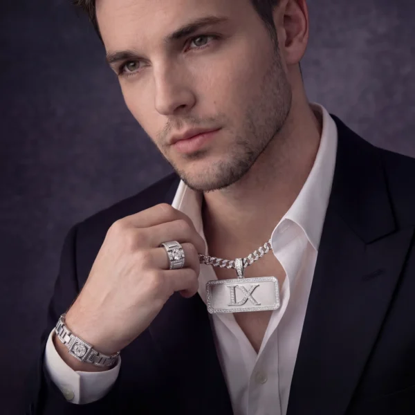 monogram-pendant-lifestyle Man in suit wearing IX plate pendant and iced ring