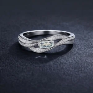 Silver Pulse ring with emerald-cut center stone.