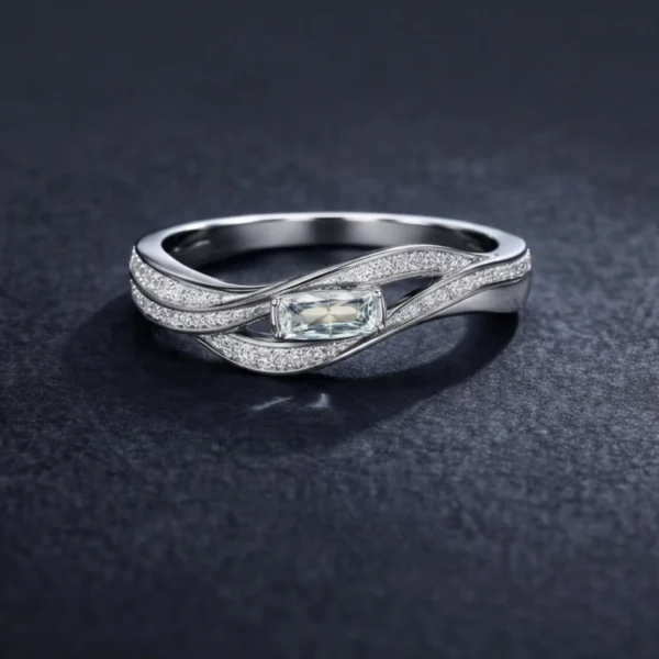 Silver Pulse ring with emerald-cut center stone.