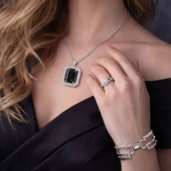 Pulse ring styled with a large black onyx pendant.