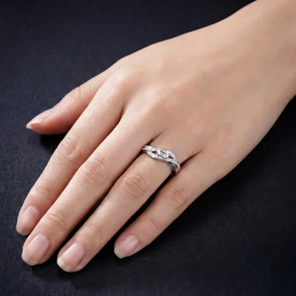 Pulse diamond ring worn on a person's hand.
