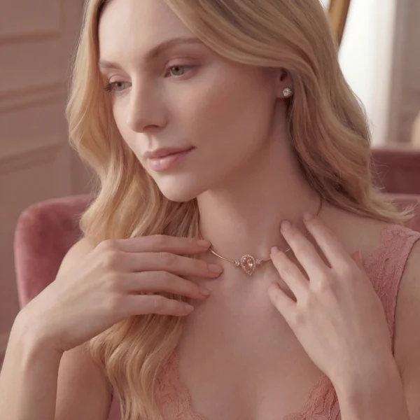 Woman showcasing a delicate teardrop necklace with pink lace dress.