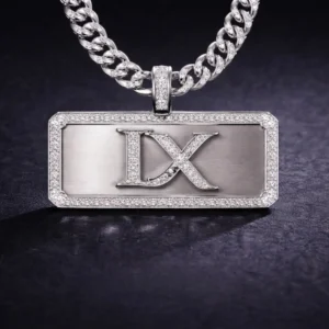 Close-up of IX monogram plate pendant on silver chain