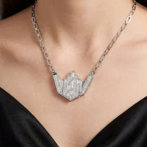 Detailed view of art deco skyline pendant on woman.