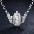 Macro studio shot of diamond-encrusted skyline pendant.