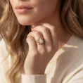 Woman wearing the Trinity Luxe ring set.