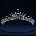 Silver Zenith Tiara with diamonds on dark blue background.